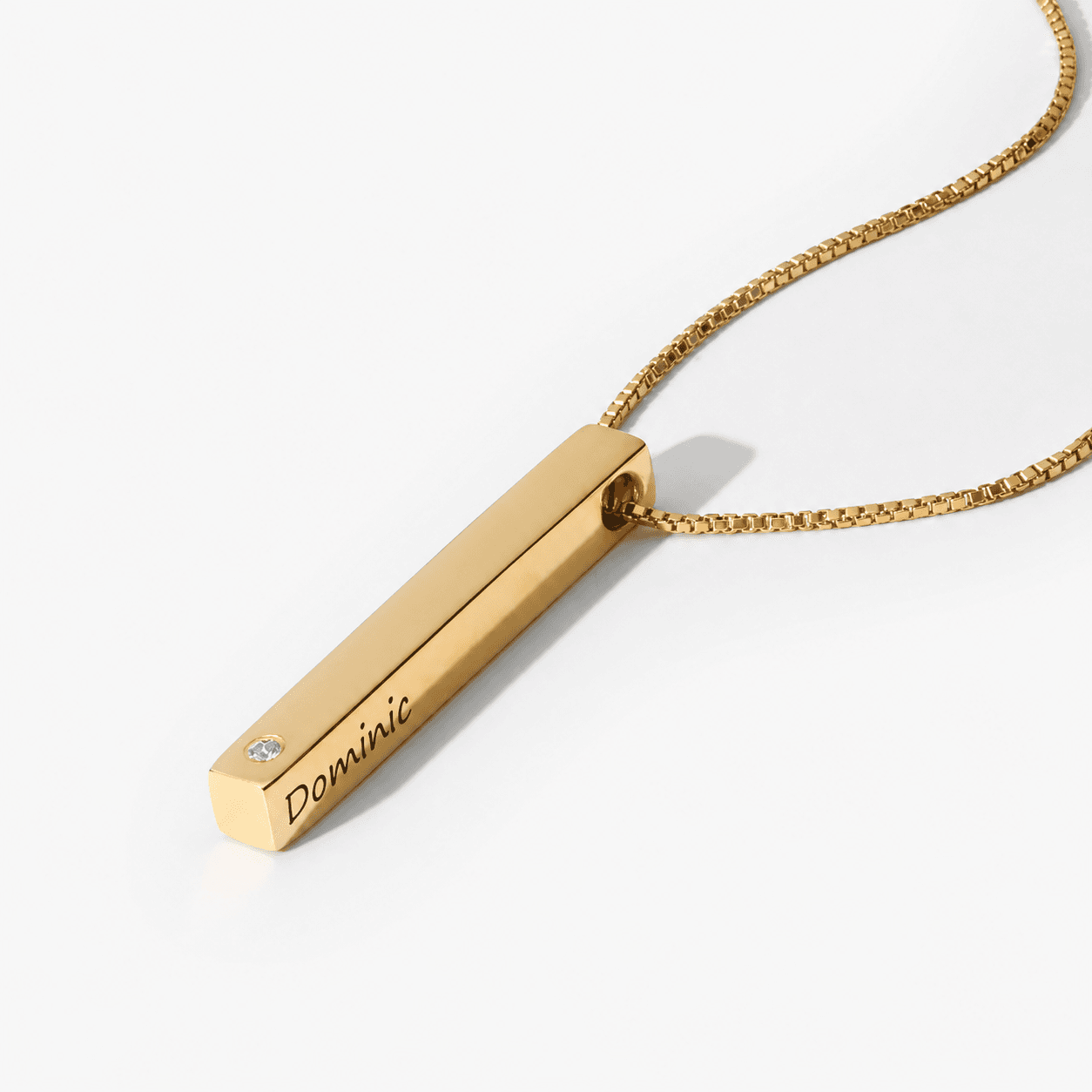 Gold Vermeil Pillar Bar Necklace with Diamond arranged on a white surface